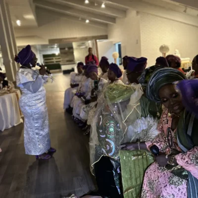 Alaga having the Brides family pray for her