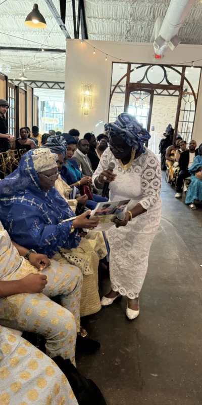 Alaga presenting letter of acceptance to Grooms Family