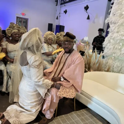 Bride kneeling in front groom