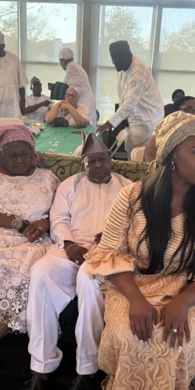 Photo of bride in snapshot with groom family